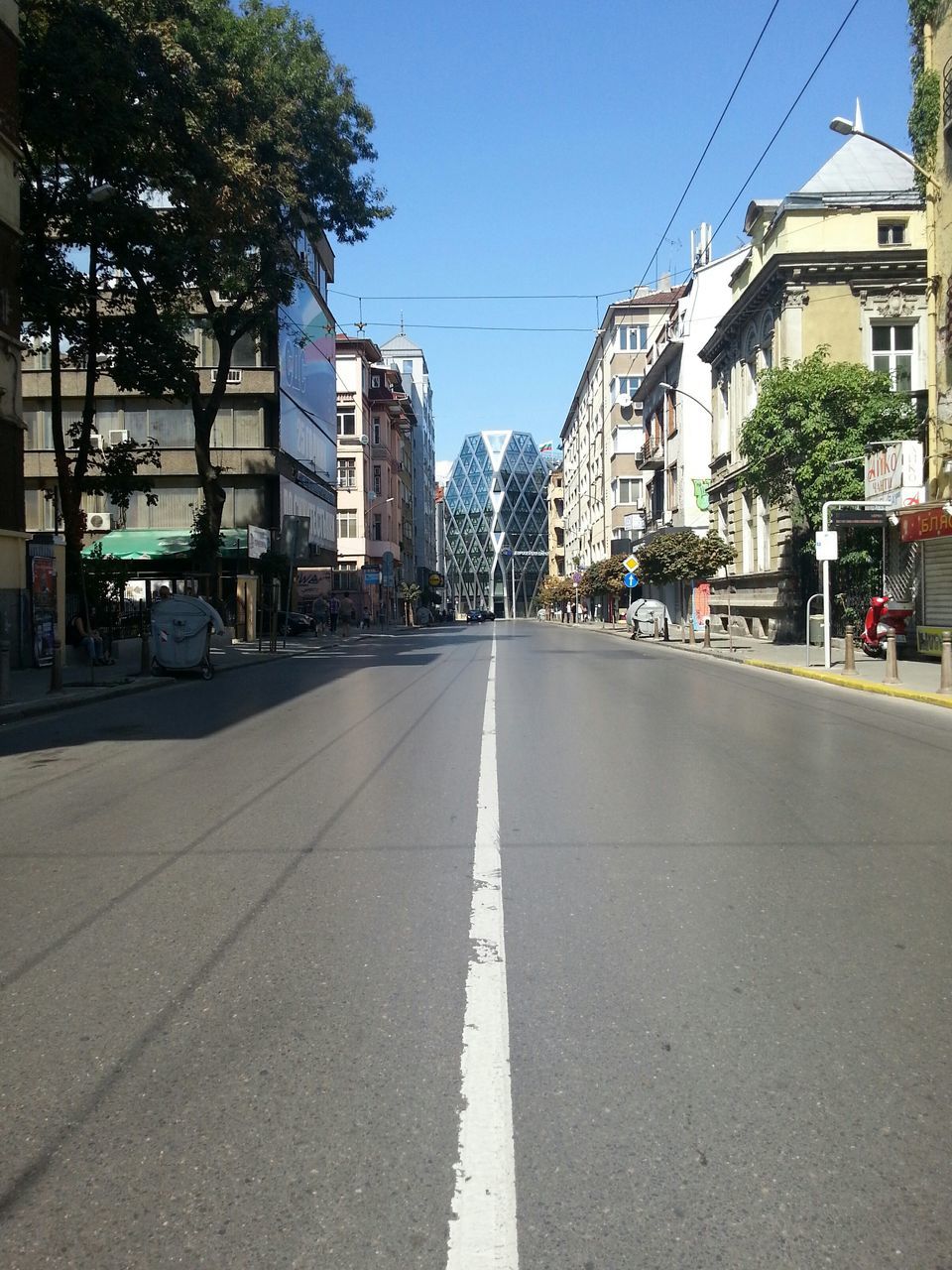 VIEW OF EMPTY ROAD ALONG BUILDINGS