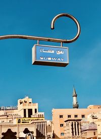 Low angle view of sign against building