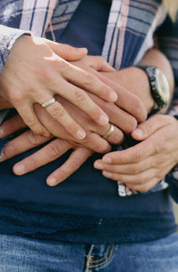 Midsection of man using mobile phone