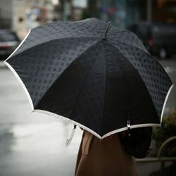 View of umbrella in city street