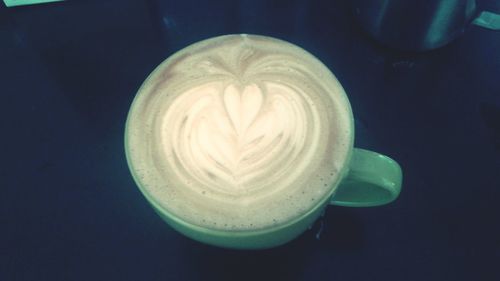 Close-up of coffee cup on table