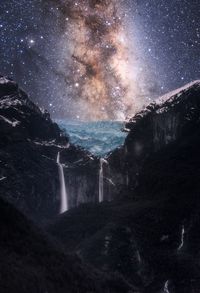 Scenic view of waterfall against star field