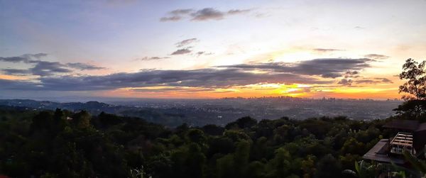 Scenic view of landscape against sky during sunset