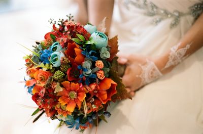 Cropped image of bride holding bouquet