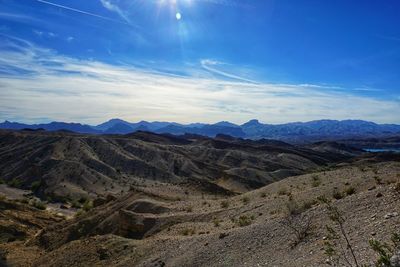 Scenic view of dramatic desert landscape against sky
