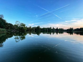 Scenic view of lake against blue sky