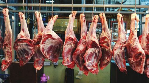 Close-up of meat hanging for sale at market