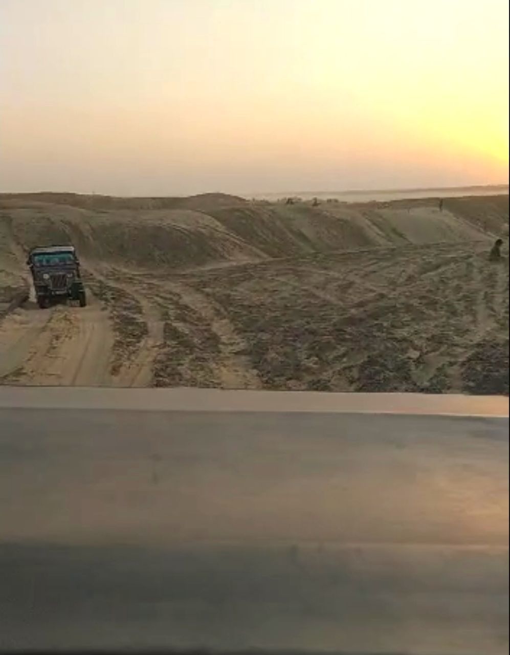 CAR ON ROAD DURING SUNSET