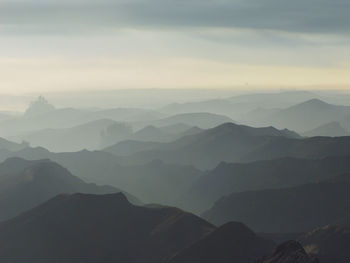 Scenic view of mountains against sky during sunrise