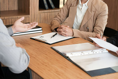 High angle view of people on table