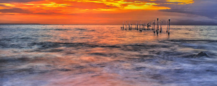 Scenic view of sea against sky during sunset