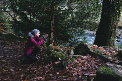 Boy with trees in park