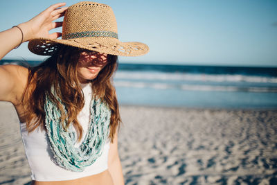 Woman standing on beach