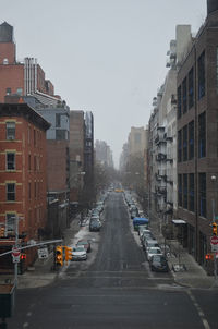 City street amidst buildings against sky
