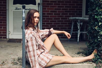 Portrait of woman sitting outdoors