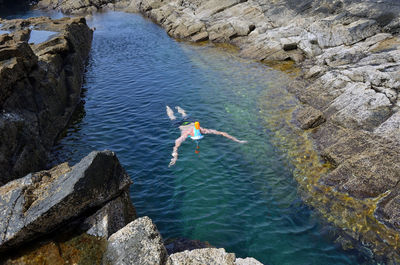 High angle view of man swimming in river