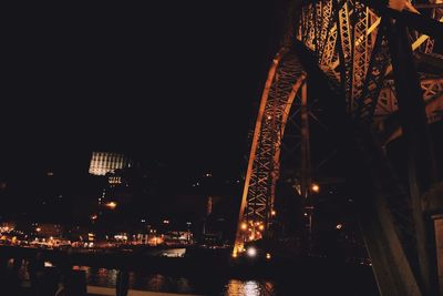 Low angle view of illuminated buildings against sky at night