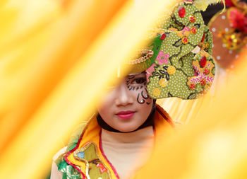 Close-up of young woman wearing costume
