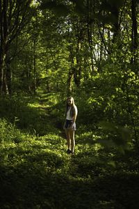 Full length of woman in forest