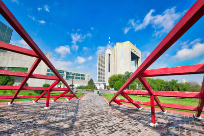 View of bridge and buildings against sky