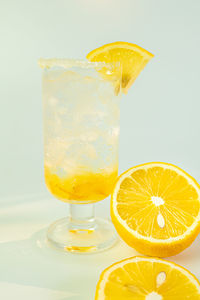 Close-up of drink on glass against white background