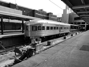 Train at railroad station in city