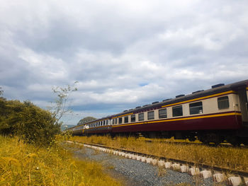 Train on railroad track against sky