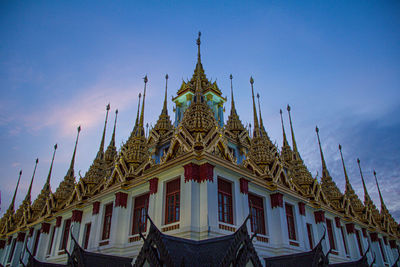 Low angle view of building against blue sky