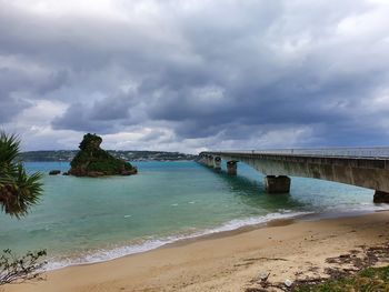 Scenic view of sea against sky, bridge in okinawa, japan