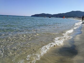 Scenic view of beach against clear sky