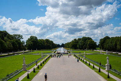 Panoramic view of footpath amidst trees against sky