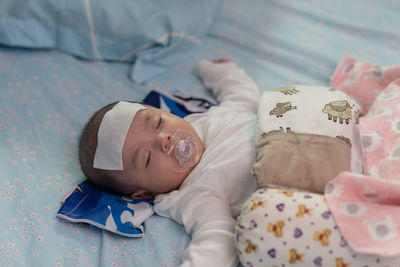 Cute baby sleeping on bed