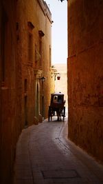 Narrow alley amidst buildings in city