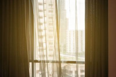 Close-up of curtain hanging on window