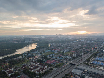 High angle view of city against sky during sunset