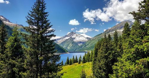 Scenic view of lake and mountains against sky