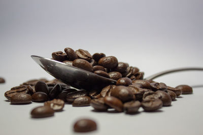 Close-up of roasted coffee beans on table