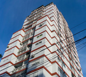 Low angle view of buildings against blue sky