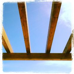 Low angle view of built structure against blue sky