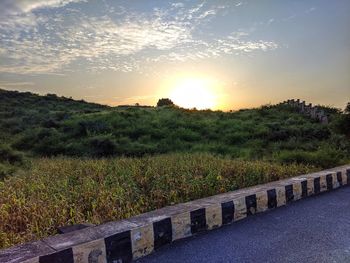 Scenic view of field against sky during sunset