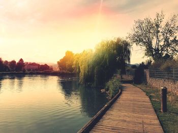 Scenic view of lake against sky during sunset