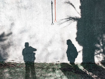 Shadow of people on wall