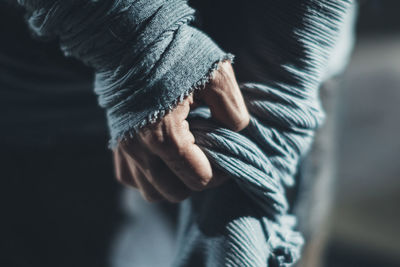 Close-up of woman standing on bench