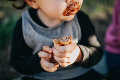 Midsection of man eating food