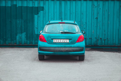 Rear view of blue car