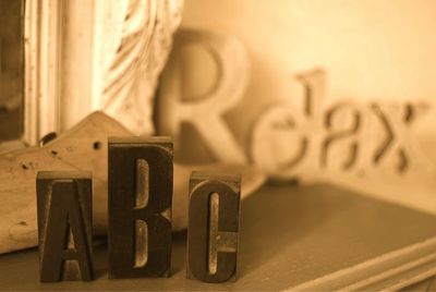 Close-up of wooden blocks spelling abc