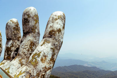 Close-up of rocks against clear sky