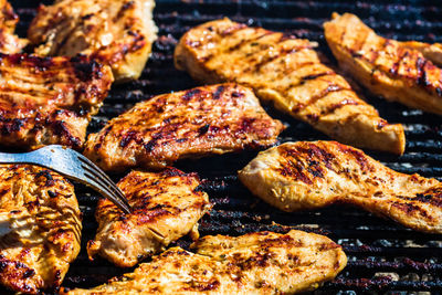 High angle view of meat on barbecue grill