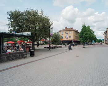 People at town square against sky