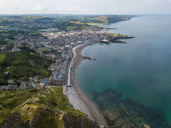 High angle view of buildings by sea